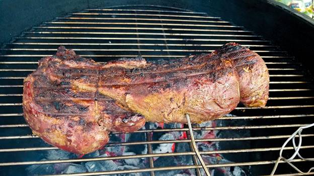 A pan of food on a grill

Description automatically generated